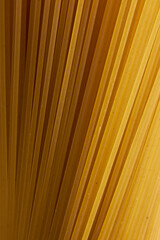 Spaghetti macro shoot. Pasta closeup on a beige background.