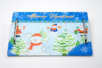 christmas themed cutting board with snowman illustration, written "merry christmas", isolated on white
