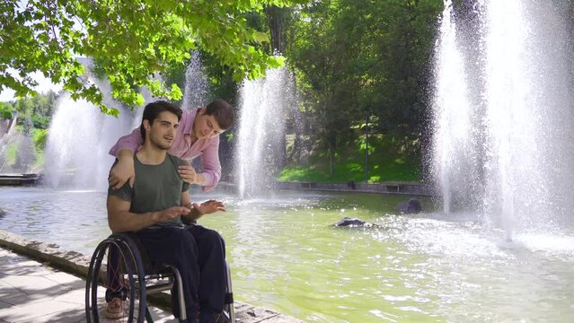 The friend who hugs the physically handicapped youth.
Pleasant time of friends with close friendships.
