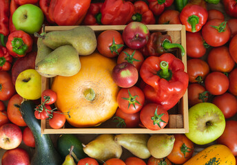Fruit and vegetable background. Wooden box full of fruit. Top view. Copy space.