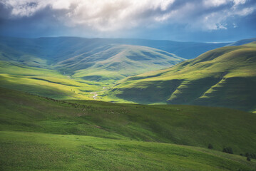 Naklejka premium Mountain green valley sunshine