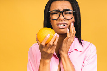 Beautiful young african american woman over isolated background touching mouth with hand with painful expression because of toothache or dental illness on teeth. Dentist concept.