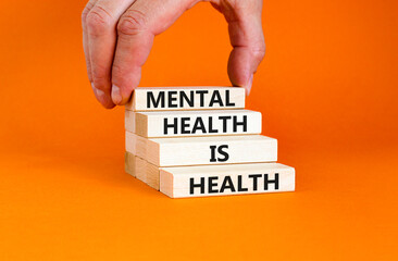 Mental health psychological symbol. Concept words Mental health is health on wooden blocks on a...