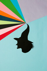 black witch head from hat colorful wave, creative art design, halloween minimal concept, flat lay, paper craft
