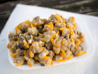 A takeaway plate of Cockles from a seafood stall from Old Leigh in Essex