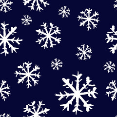 Small white ink snowflakes isolated on dark blue background. Cute monochrome Christmas seamless pattern. Vector simple flat graphic hand drawn illustration. Texture.