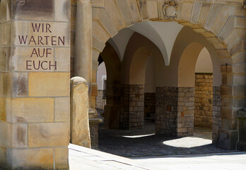 Detail of the old town hall of Bielefeld. In front is written on a pillar 'Wir warten auf euch'....