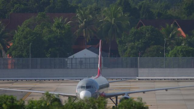 Jet airplane pushing back at Phuket airport. Tourism and travel concept