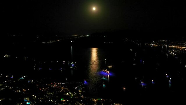 party at a luxury yacht at night, aerial view