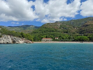 Summer vacation on the beach, waves and rocks, sunny day