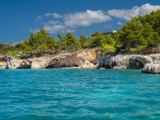 Obraz premium Beautiful beach with stone caves in Greece