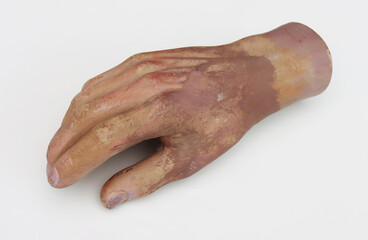 Part of a man's plastic arm from a mannequin.