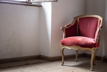 Old European furniture in an old house. Red wooden armchairs, antiques and expensive furniture in the interior.