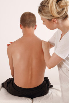 Adolescent Scoliosis Posture Correction. Physical therapy and diagnostics. Doctor and teenage patient