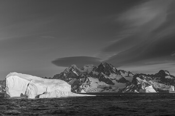 South Georgia Island. Black and white Landscape with Icebergs, mountain, snow and clouds.