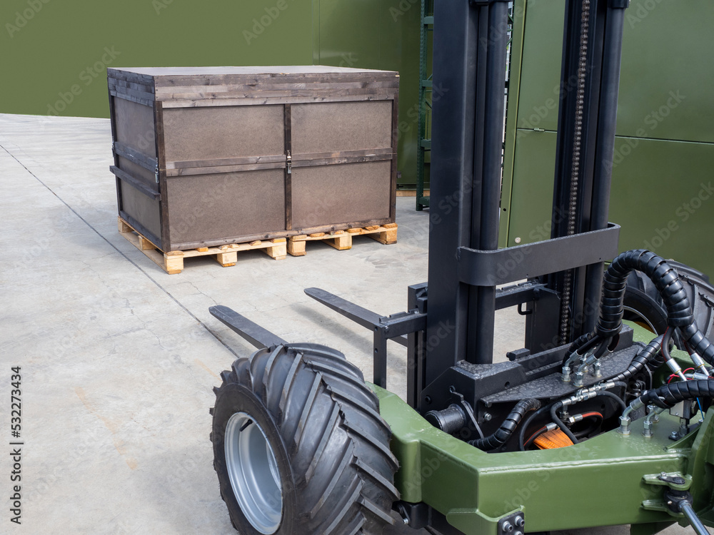 Poster loading and unloading process. fragment forklift. forklift pulls up to huge crate. equipment for log