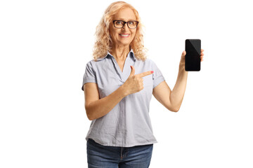 Casual mature woman holding a smartphone and pointing at the screen