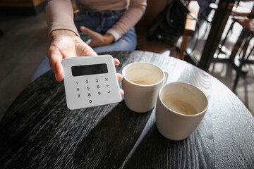 payment in a restaurant or cafe using a mobile terminal