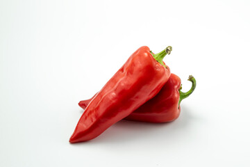 Two fresh sweet red peppers paprika isolated on white background