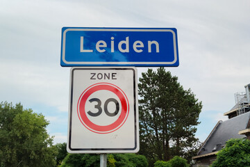 Place name sign of the city of Leiden. Board below means that in that zone the speed limit is 30.