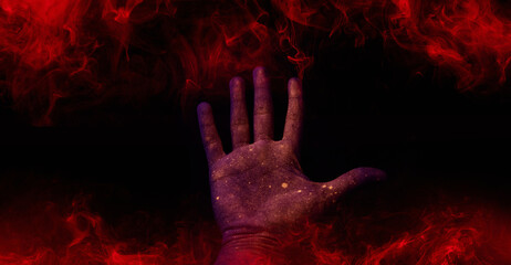 A scary hand on dark background. Mysterious composition. Fortune teller, mind power, prediction,...