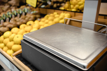 a scale for weighing fruit in a supermarket, concept of healthy life for the fruit consumer