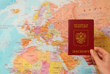 Fototapeta na wymiar Russian federation passport in front of Europe map.
