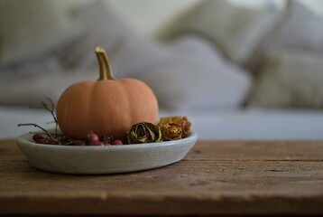 autumn still life in the living room. Halloween decoration, pumpkin, candle