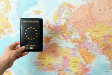 European Union passport in front of Europe map.