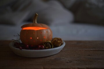 autumn still life in the living room. Halloween decoration, pumpkin, candle