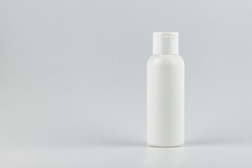 cosmetic flacon tube on white background. white unbranded cosmetic flacon mock up. branding identity flacon mockup concept. blank label