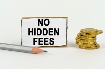 On a white background, a pencil, coins and a sign with the inscription - No hidden fees