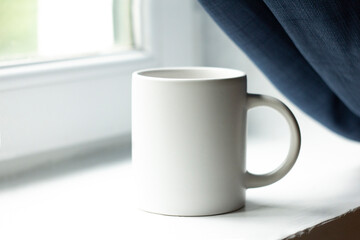 White mug on the windowsill - 532280807