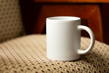 White mug on the chair - 532280839
