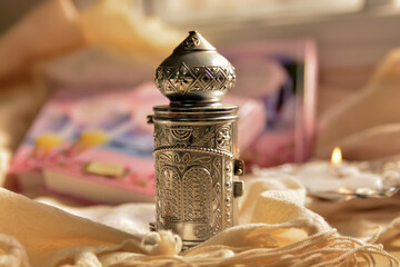 A small Torah scrolls A silver antique with a tour of the tablets of the covenant with the Hebrew...