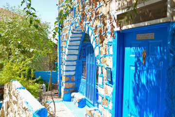 Translation of the sign on the door: G-d from heaven looked down on men, to see there is G-d
A beautiful blue ancient building in the alleys of the city of Safed in Israel