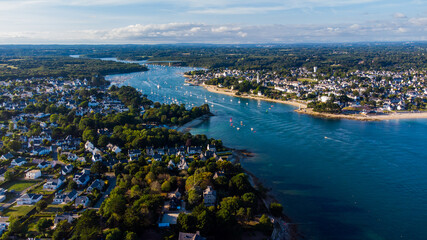 Aerial view of the mouth of the river Odet in Bénodet, a seaside resort town in Finistère, France - Sailboats heading into the Atlantic Ocean in the south of Brittany - obrazy, fototapety, plakaty