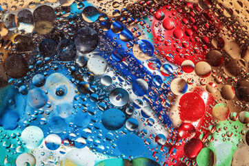 Abstract colorful oil circles on water surface