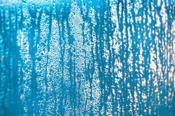 Naklejka na ściany i meble Texture of misted glass in winter.