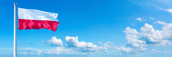 Poland flag on a blue sky *** Horizontal banner 12000 x 4005 px