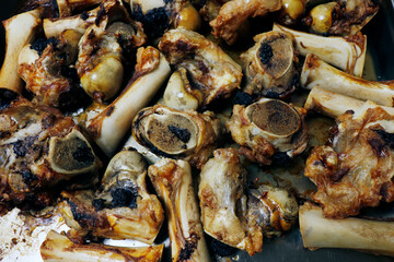 roasted veal marrow bone or beef bone from the oven for stock or sauce preparation