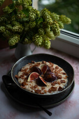 Oatmeal for breakfast with figs and agave syrup