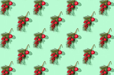 Pattern of christmas decoration on a green pastel background