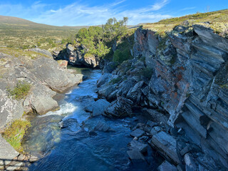 Obraz premium Waterfall inside Dovre National Park, Norway, Scandinavia, Europe