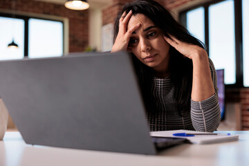 Sleepy woman working from home and feeling stressed about overload and deadline, unhappy employee....