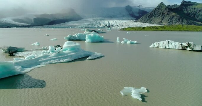 An aerial shot of some melting icebergs