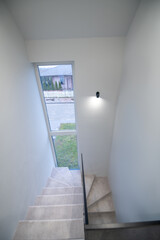 Entrance hall interior with the carpeted stairs