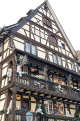 Fototapeta na wymiar Strasbourg, France. Example of half-timber architecture from the medieval era. Building is decorated with Christmas.