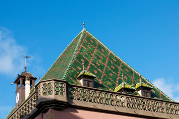Colmar, France. Old town Colmar which was founded in the 9th century. Interesting green tiled rooftop. - obrazy, fototapety, plakaty
