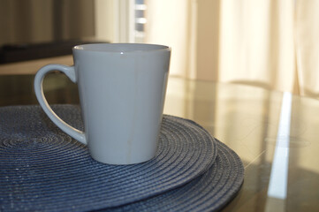 
WHITE CUP OF COFFEE